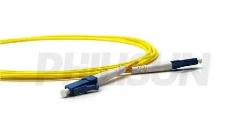 A coiled yellow fiber optic patch cable with a blue LC connector on one end and a black LC connector on the other, both against a white background.
